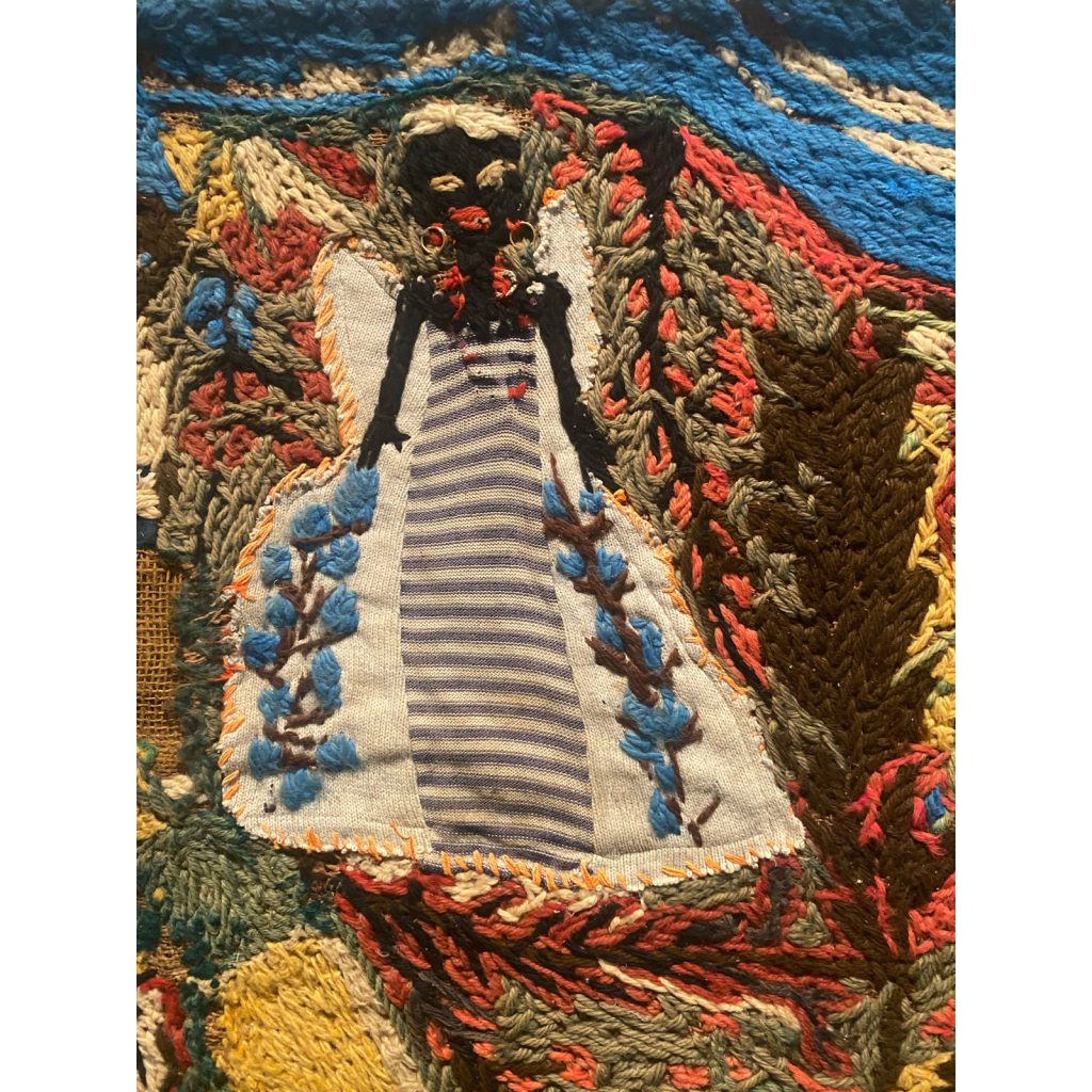 Detail of female figure in a white and blue dress by MSR